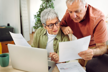 senior couple reviewing documents
